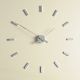 Horloge design TACON i Nomon en acier, 12 repères horaires
