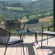 Table basse, fauteuils lounge et canapé de jardin noirs DARWIN Emu